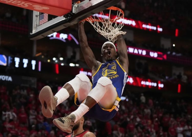 Jimmy Butler dunks ball Photo Courtesy: AP