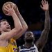 Luka Doncic attempts shot against Julius Randle Photo Courtesy: AP