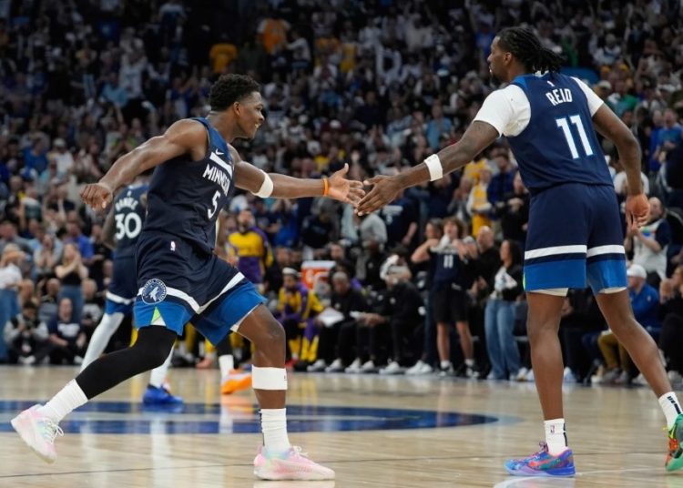 Anthony Edwards celebrates with Naz Reid (right) Photo Courtesy: AP