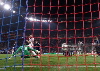 Rayan Cherki  scores his team's second goal past Andre Onana (Photo by Michael Steele/Getty Images)