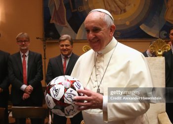 Pope Francis holds a gift of FC Bayern Muenchen during an private audience with the team of  FC Bayern Muenchen (Photo by Alexander Hassenstein/Bongarts/Getty Images)