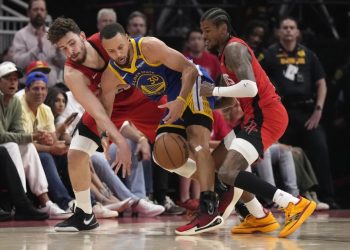 Steph Curry (middle) battles for ball against Houston Rockets Photo Courtesy: AP