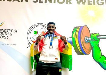 Gabriel Owusu proudly displaying his medals