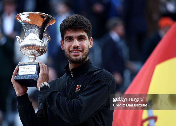 Carlos Alcaraz of Spain poses with the trophy as he celebrates victory against Jannik Sinner of Italy (Photo by Dan Istitene/Getty Images)