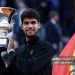 Carlos Alcaraz of Spain poses with the trophy as he celebrates victory against Jannik Sinner of Italy (Photo by Dan Istitene/Getty Images)
