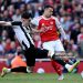Gabriel Martinelli of Arsenal is challenged by Tino Livramento of Newcastle United (Photo by Mike Hewitt/Getty Images)