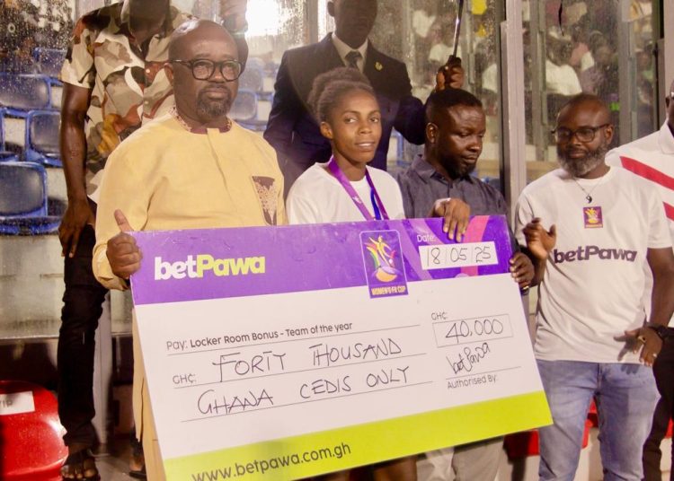 GFA President , Kurt Okraku presenting Check to Faith Ladies after winning FA Cup