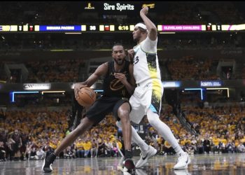 Evan Mobley (with ball) is defended by Myles Turner Photo Courtesy: AP