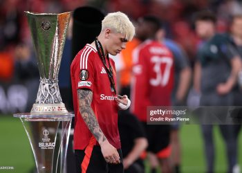 Alejandro Garnacho of Manchester United walks past the UEFA Europa League trophy (Photo by Ryan Pierse/Getty Images)