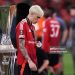 Alejandro Garnacho of Manchester United walks past the UEFA Europa League trophy (Photo by Ryan Pierse/Getty Images)