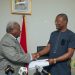 Major Retired Amarkai Amarteifio (left) presents boxing report to Sports Minister Kofi Adams
