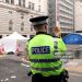 A police officer stands guard at the entrance of Water Street on May 27, 2025 in Liverpool, England. Investigation and cleanup continued this morning after a car ploughed into a crowd gathered yesterday for the Liverpool F.C. victory parade, injuring nearly 50 people, including four children. Authorities said the suspect was arrested and they are not treating it as an act of terrorism. (Photo by Jan Kruger/Getty Images)