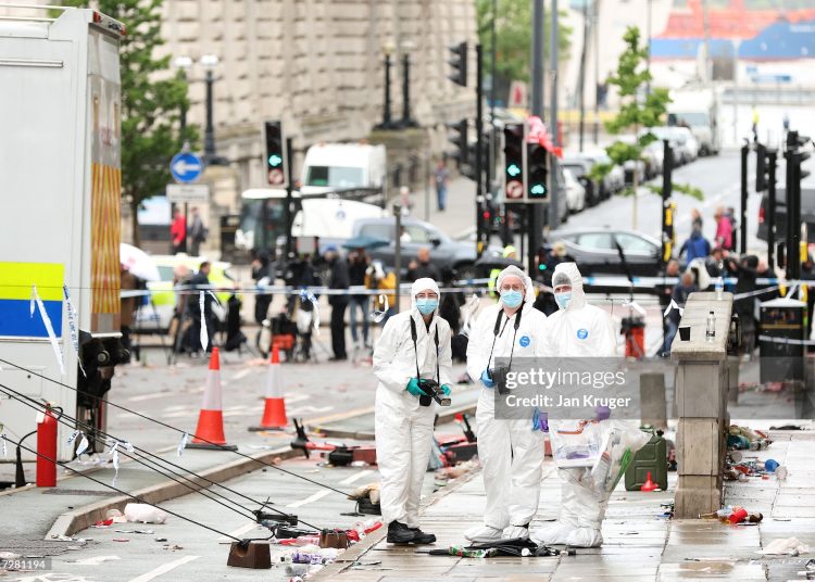 Crime Scene Investigators at the scene of the Liverpool FC parade incident on Water Street on May 27, 2025 in Liverpool, England. Investigation and cleanup continued this morning after a car ploughed into a crowd gathered yesterday for the Liverpool F.C. victory parade, injuring nearly 50 people, including four children. Authorities said the suspect was arrested and they are not treating it as an act of terrorism. (Photo by Jan Kruger/Getty Images)