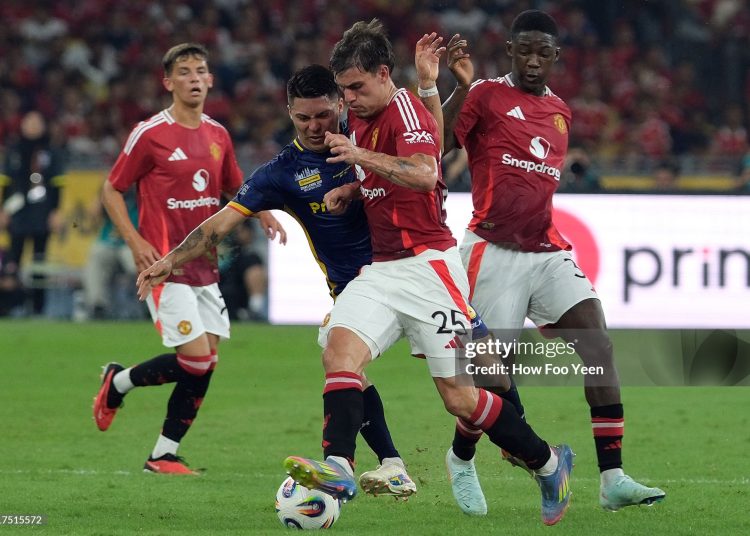 Manuel Ugarte of Manchester United and Sergio Fabian Ezequiel Aguero of Asean All Stars  (Photo by How Foo Yeen/Getty Images)