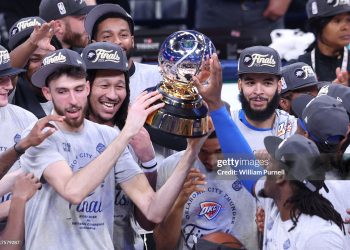 Chet Holmgren #7 of the Oklahoma City Thunder and teammates raise the Oscar Robertson Trophy after defeating the Minnesota Timberwolves 124-94 in Game Five of the Western Conference Finals (Photo by William Purnell/Getty Images)