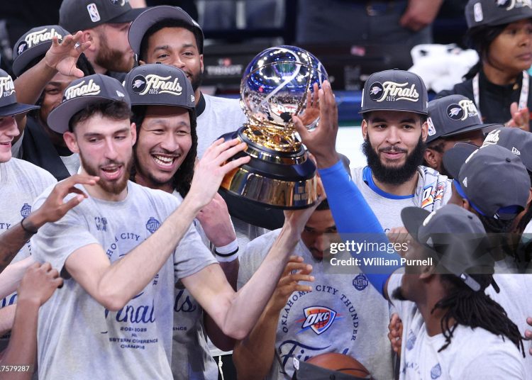 Chet Holmgren #7 of the Oklahoma City Thunder and teammates raise the Oscar Robertson Trophy after defeating the Minnesota Timberwolves 124-94 in Game Five of the Western Conference Finals (Photo by William Purnell/Getty Images)