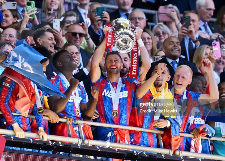 Joel Ward of Crystal Palace the FA Cup trophy after their team's victory in the Emirates FA Cup Final (Photo by Mike Hewitt/Getty Images)