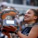 Jasmine Paolini of Italy poses for a photo with the trophy following victory against Coco Gauff of United States in the Women's Singles Final match (Photo by Dan Istitene/Getty Images)