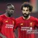 Liverpool's Senegalese striker Sadio Mane (L) speaks with Liverpool's Egyptian midfielder Mohamed Salah (Photo by KARIM JAAFAR / AFP) (Photo by KARIM JAAFAR/AFP via Getty Images)