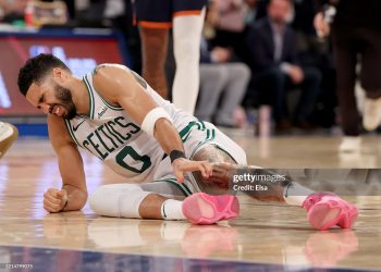 Jayson Tatum #0 of the Boston Celtics lays on the ground after being injured against the New York Knicks (Photo by Elsa/Getty Images)