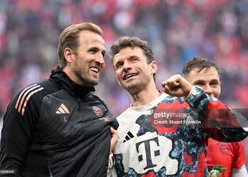 Harry Kane with Thomas Mueller (Photo by Stuart Franklin/Getty Images)