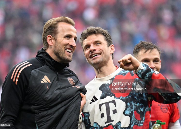 Harry Kane with Thomas Mueller (Photo by Stuart Franklin/Getty Images)