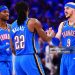 Alex Caruso #9, Cason Wallace #22 and Shai Gilgeous-Alexander #2 of the Oklahoma City Thunder react during the fourth quarter against the Denver Nuggets (Photo by Joshua Gateley/Getty Images)