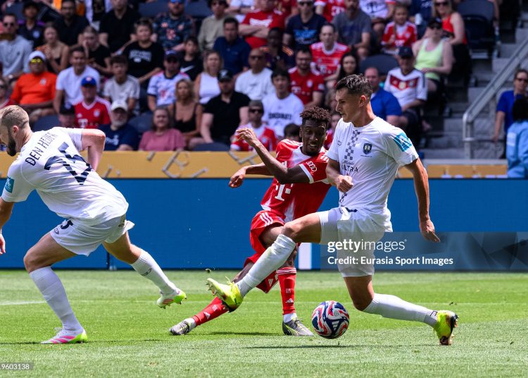 Kingsley Coman of Bayern (C) attempts a kick for score his goal over Thomas Mitchel of Auckland City (R) during the FIFA Club World Cup 2025 (Photo by Marcio Machado/Eurasia Sport Images/Getty Images)