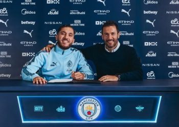 Rayan Cherki (left) poses for photo after joining Man City Photo Courtesy: Man City