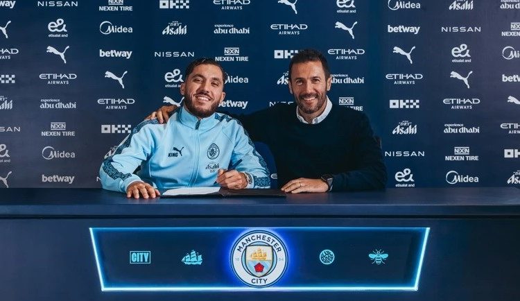 Rayan Cherki (left) poses for photo after joining Man City Photo Courtesy: Man City