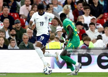 Noni Madueke of England controls the ball under pressure from El Hadji Malick Diouf of Senegal (Photo by Eddie Keogh - The FA/The FA via Getty Images)