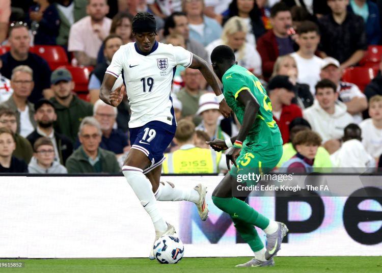Noni Madueke of England controls the ball under pressure from El Hadji Malick Diouf of Senegal (Photo by Eddie Keogh - The FA/The FA via Getty Images)