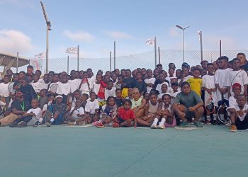 Participants of Tennis Clinic pose with Katrina Adams