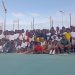 Participants of Tennis Clinic pose with Katrina Adams