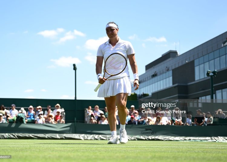 Ons Jabeur of Tunisia reacts against Viktoriya Tomova of Bulgaria during the Ladies' Singles first round match on day one of The Championships Wimbledon 2025 (Photo by Hannah Peters/Getty Images)