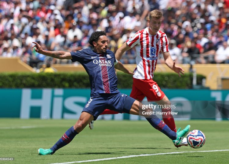 Marquinhos #5 of Paris Saint-Germain battles for possession with Alexander Soerloth #9 of Atletico De Madrid during the FIFA Club World Cup 2025 (Photo by Harry How/Getty Images)