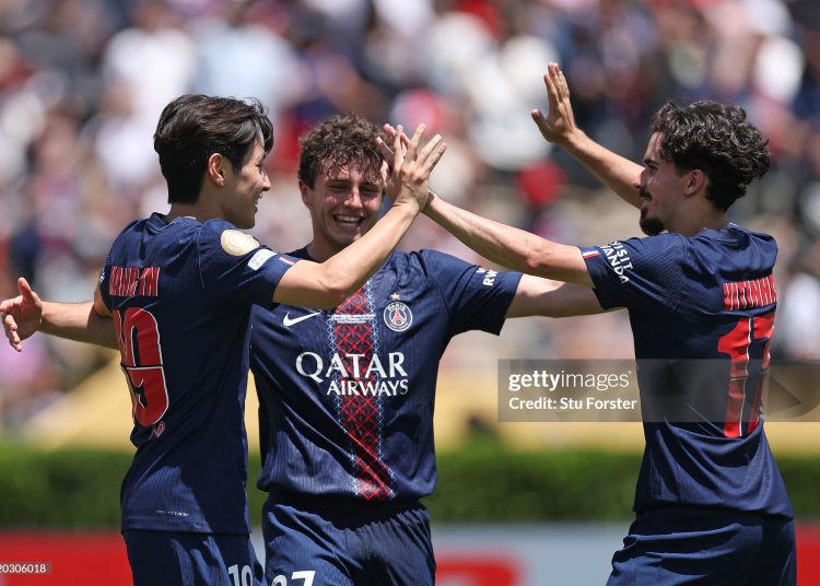 Vitinha #17, Lee Kang-in #19 and Joao Neves #87 of Paris Saint-Germain celebrate following the team's victory in the FIFA Club World Cup 2025 (Photo by Stu Forster/Getty Images)