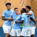 Phil Foden #47 of Manchester City celebrates with teammates after scoring his team's first goal  (Photo by David Ramos/Getty Images)
