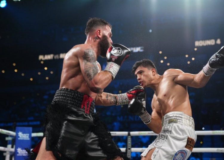 Armando Resendiz (right) in action against Caleb Plant Photo Courtesy: PremierBoxing on X