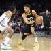 Devin Booker #1 of the Phoenix Suns handles the ball against Jalen Williams #8 of the Oklahoma City Thunder (Photo by Christian Petersen/Getty Images)