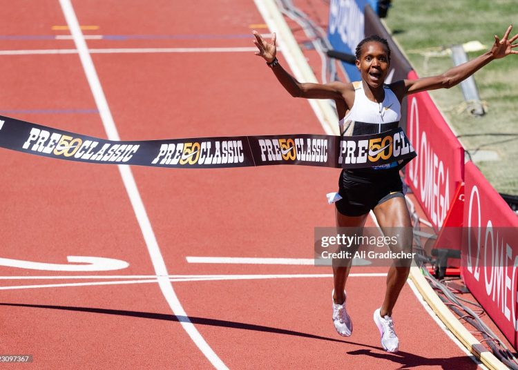 Faith Kipyegon of Kenya competes in the Women's 1500m and sets a new world record (Photo by Ali Gradischer/Getty Images)
