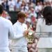 Jannik Sinner admires the Gentlemen’s Singles Trophy following his victory against Carlos Alcaraz. (Photo by Julian Finney/Getty Images)