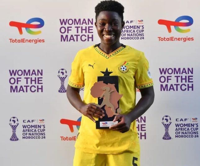 Grace Asantewaa (5) displays Woman of the Match Award Photo Courtesy: CAF