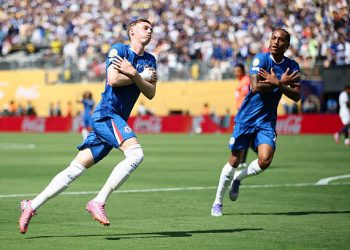 Cole Palmer celebrates scoring his team's first goal. (Photo by Alex Grimm/Getty Images)