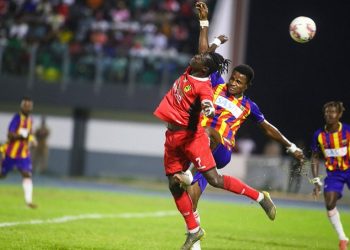 Kotoko striker Kwame Opoku (red) in action against Hearts of Oak in GHALCA Top 4 Photo Courtesy: AKSC