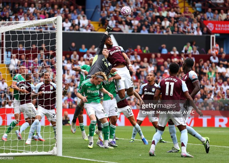 Marco Bizot of Aston Villa punches the ball clear whilst under pressure from Anthony Gordon of Newcastle United as teammate Tyrone Mings jumps for a header . (Photo by Marc Atkins - AVFC/Aston Villa FC via Getty Images)