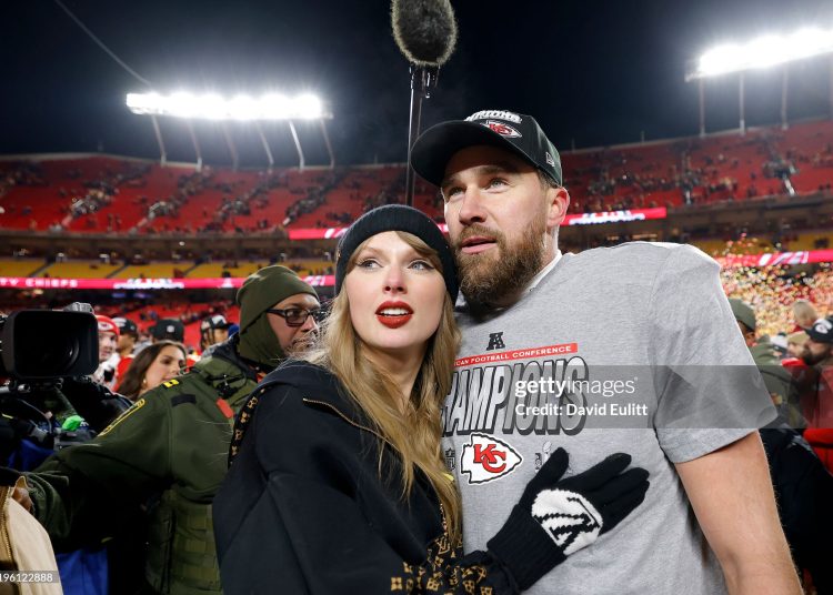 Taylor Swift celebrates with Travis Kelce #87 of the Kansas City Chiefs after defeating the Buffalo Bills (Photo by David Eulitt/Getty Images)