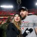 Taylor Swift celebrates with Travis Kelce #87 of the Kansas City Chiefs after defeating the Buffalo Bills (Photo by David Eulitt/Getty Images)