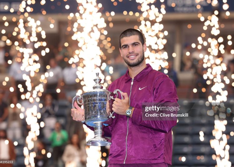 Carlos Alcaraz of Spain poses with his trophy after defeating Jannik Sinner of Italy during their Men's Singles Final match on Day Fifteen of the 2025 US Open (Photo by Clive Brunskill/Getty Images)