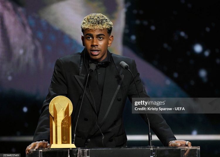 Lamine Yamal speaks on stage with the Men's Kopa Trophy during the 69th Ballon D'Or Ceremony (Photo by Kristy Sparow - UEFA/UEFA via Getty Images)
